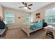Bedroom featuring neutral walls, a ceiling fan, and lots of natural light at 5130 Pratt Sw St, Covington, GA 30014