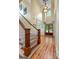 Grand foyer with hardwood floors, staircase, and chandelier at 5130 Pratt Sw St, Covington, GA 30014