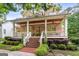 Inviting brick home with a spacious porch and well-maintained yard at 5130 Pratt Sw St, Covington, GA 30014