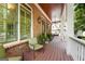 Relaxing covered front porch with comfortable seating and green shutters at 5130 Pratt Sw St, Covington, GA 30014