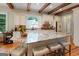 Kitchen island with stone countertop and seating plus stainless steel appliances at 5130 Pratt Sw St, Covington, GA 30014