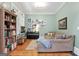 Inviting living space with a comfortable sofa, piano and custom bookshelf at 5130 Pratt Sw St, Covington, GA 30014