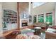 Spacious living area with custom bookshelves and a striking brick fireplace feature at 5130 Pratt Sw St, Covington, GA 30014