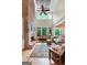 Grand living room with a brick fireplace, tall windows, and comfortable seating at 5130 Pratt Sw St, Covington, GA 30014