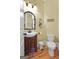 Functional powder room with a unique mirror and charming decorative touches at 5130 Pratt Sw St, Covington, GA 30014