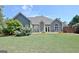 Beautiful home with mature landscaping, french doors, an arched window, and a lush backyard at 260 Bonnie Ln, Fayetteville, GA 30215