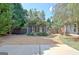 Backyard with mature landscaping, gravel ground cover and privacy fence at 260 Bonnie Ln, Fayetteville, GA 30215