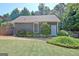Backyard featuring a well manicured lawn and lush shrubbery at 260 Bonnie Ln, Fayetteville, GA 30215