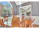 Bright dining room featuring hardwood floors and large windows creating an inviting and airy atmosphere at 260 Bonnie Ln, Fayetteville, GA 30215