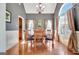 Elegant dining room featuring hardwood floors, large window, and chandelier, perfect for entertaining at 260 Bonnie Ln, Fayetteville, GA 30215