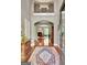Grand foyer with hardwood floors, detailed millwork, and view into the living area and an upstairs balcony at 260 Bonnie Ln, Fayetteville, GA 30215