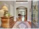 Elegant foyer with hardwood floors, detailed millwork, and view into the living area with fireplace at 260 Bonnie Ln, Fayetteville, GA 30215