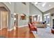 Open-concept living room featuring hardwood floors, high ceilings, and seamless flow to other living spaces at 260 Bonnie Ln, Fayetteville, GA 30215