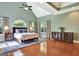 Spacious main bedroom with tray ceilings, large windows, and hardwood floors at 260 Bonnie Ln, Fayetteville, GA 30215