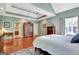 Large main bedroom with tray ceilings, hardwood floors, and a decorative rug at 260 Bonnie Ln, Fayetteville, GA 30215
