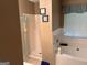Bathroom with a large tub, separate shower, and well-lit vanity area at 8519 Glenwoods Dr, Riverdale, GA 30274
