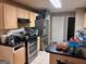 Functional kitchen featuring stainless steel appliances, granite countertops, and tile backsplash at 8519 Glenwoods Dr, Riverdale, GA 30274