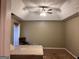 A bedroom featuring a ceiling fan, neutral carpet and a bright window at 8519 Glenwoods Dr, Riverdale, GA 30274