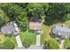 Stunning aerial view of a suburban neighborhood, surrounded by lush greenery and mature trees at 7505 Brookwood Way, Cumming, GA 30041