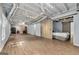 Finished basement space with vinyl floors and sliding barn door at 7505 Brookwood Way, Cumming, GA 30041