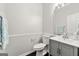 Half-bathroom with modern vanity and fixtures at 7505 Brookwood Way, Cumming, GA 30041