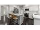 Modern kitchen with white cabinetry, stainless steel appliances, and a convenient center island at 7505 Brookwood Way, Cumming, GA 30041