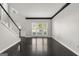 Bright living room with dark trim, hardwood floors, and plenty of natural light at 7505 Brookwood Way, Cumming, GA 30041