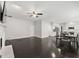 Spacious living room and kitchen combo with stainless steel appliances and dark hardwood floors at 7505 Brookwood Way, Cumming, GA 30041