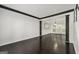 Bright, open living space with dark trim, hardwood floors, and a view of the dining room at 7505 Brookwood Way, Cumming, GA 30041