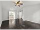 Primary bedroom with hardwood floors, ensuite bathroom, and walk-in closet at 7505 Brookwood Way, Cumming, GA 30041