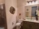 Bathroom with shower, toilet and vanity with glass vessel sink at 522 Blue Mountain Rise, Canton, GA 30114