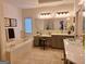 Elegant bathroom with double vanity, soaking tub, and stylish fixtures at 522 Blue Mountain Rise, Canton, GA 30114