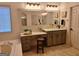 Bathroom vanity with glass vessel sink, makeup area, and tile flooring at 522 Blue Mountain Rise, Canton, GA 30114