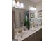 Elegant bathroom featuring a double sink vanity, warm lighting, and stylish fixtures and hardware at 522 Blue Mountain Rise, Canton, GA 30114
