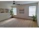Spacious carpeted bedroom with ample natural light, featuring neutral color scheme and artwork at 522 Blue Mountain Rise, Canton, GA 30114