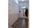 Walk-in closet with ample shelving and dark floors at 522 Blue Mountain Rise, Canton, GA 30114