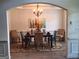 Arched dining room with tray ceiling, chandelier and decor at 522 Blue Mountain Rise, Canton, GA 30114