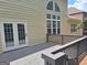 Attractive home exterior with a wooden deck, French doors, and abundant natural light at 522 Blue Mountain Rise, Canton, GA 30114