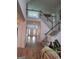 Open foyer featuring hardwood floors, staircase, and a view of the home's upper level at 522 Blue Mountain Rise, Canton, GA 30114