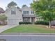 Traditional two-story home with a manicured lawn and attached two-car garage in a neighborhood setting at 522 Blue Mountain Rise, Canton, GA 30114