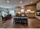 Modern kitchen features an island with seating, stainless steel appliances, and adjacent dining area at 522 Blue Mountain Rise, Canton, GA 30114