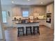 Modern kitchen features an island with seating, stainless steel appliances, and stylish countertops at 522 Blue Mountain Rise, Canton, GA 30114