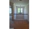 Upstairs landing with a view of a chandelier and window for natural light at 522 Blue Mountain Rise, Canton, GA 30114