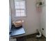 Functional laundry room featuring a folding table, a window, and shelving for storage at 522 Blue Mountain Rise, Canton, GA 30114