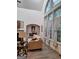 Bright living room featuring a fireplace, decor, and expansive windows for plenty of natural light at 522 Blue Mountain Rise, Canton, GA 30114