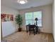 Bright home office space with large windows and neutral decor provides an ideal work environment at 522 Blue Mountain Rise, Canton, GA 30114