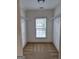 Empty walk-in closet featuring carpet and a window with wire shelving on each side at 522 Blue Mountain Rise, Canton, GA 30114