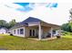 This cozy back porch includes outdoor seating and a grill at 40 Westbrook Rd, Carrollton, GA 30116