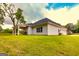 The backyard of this home features a covered back porch and lush green grass at 40 Westbrook Rd, Carrollton, GA 30116