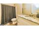 Cozy bathroom featuring granite counters, a white vanity, and a shower with a curtain at 40 Westbrook Rd, Carrollton, GA 30116